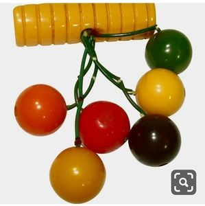 Carved Bakelite dangling vintage pin